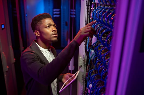concentrated-black-it-engineer-checking-connection-2023-11-27-05-36-06-utc